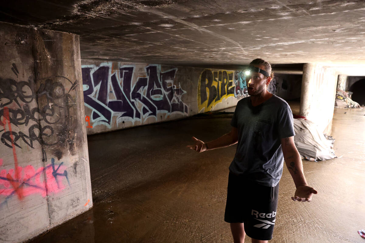A.J., who declined to give his last name, talks to a reporter in the flood control tunnel where ...
