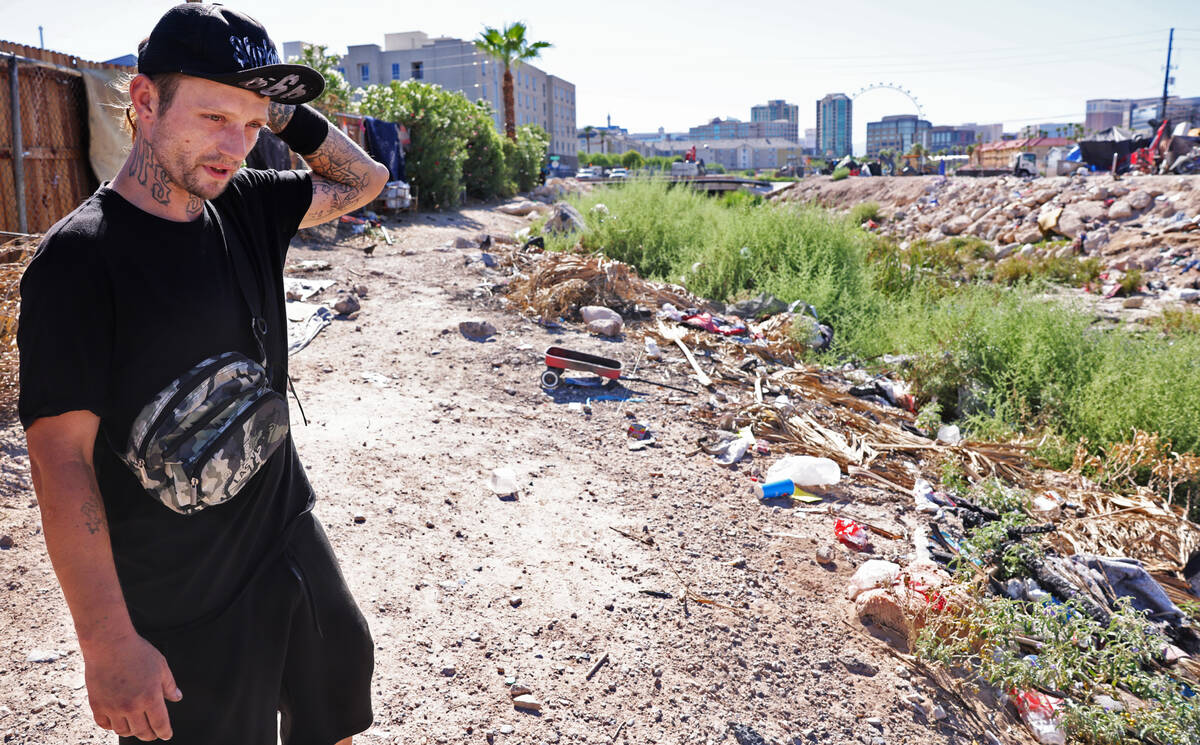 Bud Lee Hill, 37, talks to a reporter along the Tropicana Wash near University Center Drive eas ...