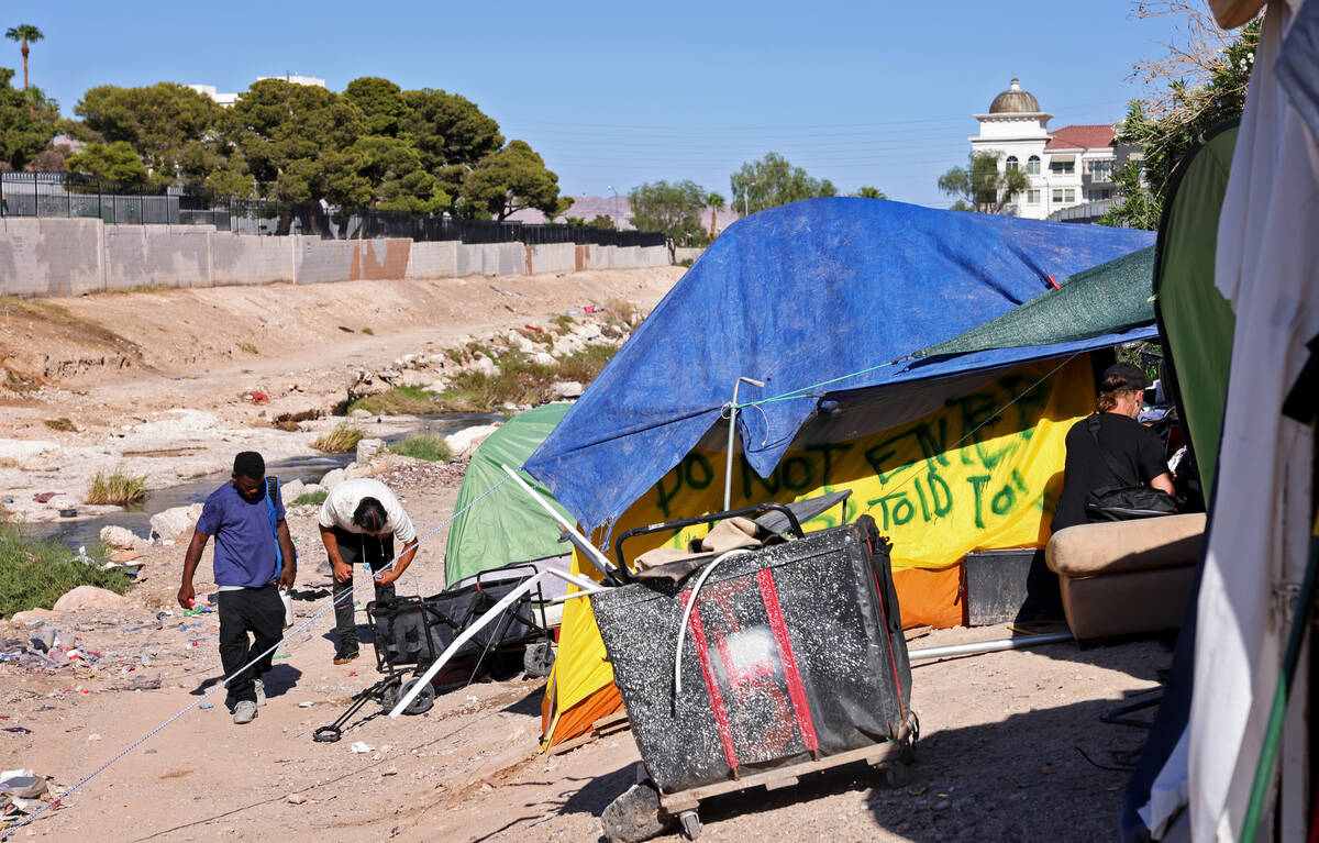 People camp along the Tropicana Wash near University Center Drive east of the Strip in Las Vega ...