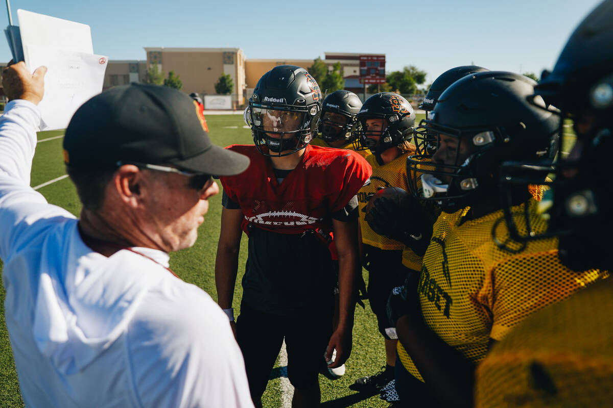 Somerset-Losee head football coach Dan Barnson, left, speaks to his players during practice at ...