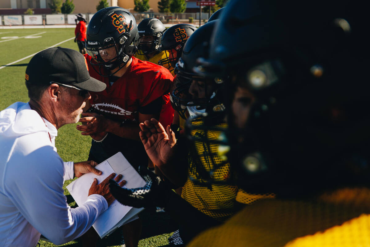 Somerset-Losee head football coach Dan Barnson, left, speaks to his players during practice at ...