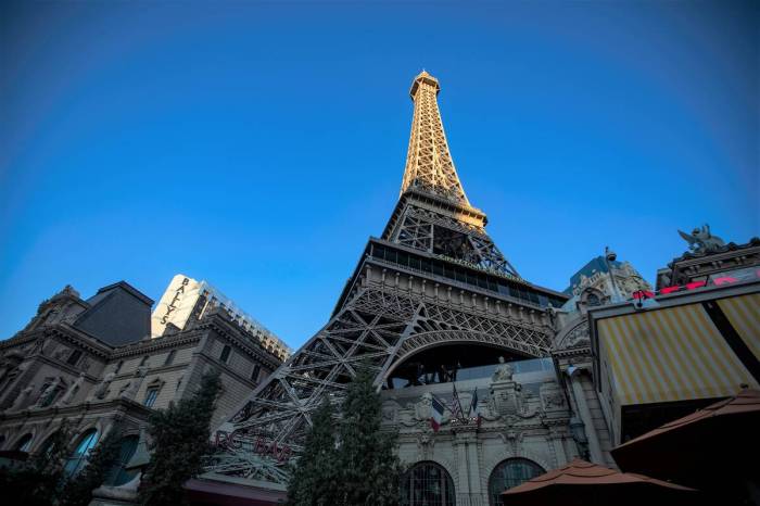 Replica of the Eiffel Tower lit up at night, Paris Las Ve - Canvas Art