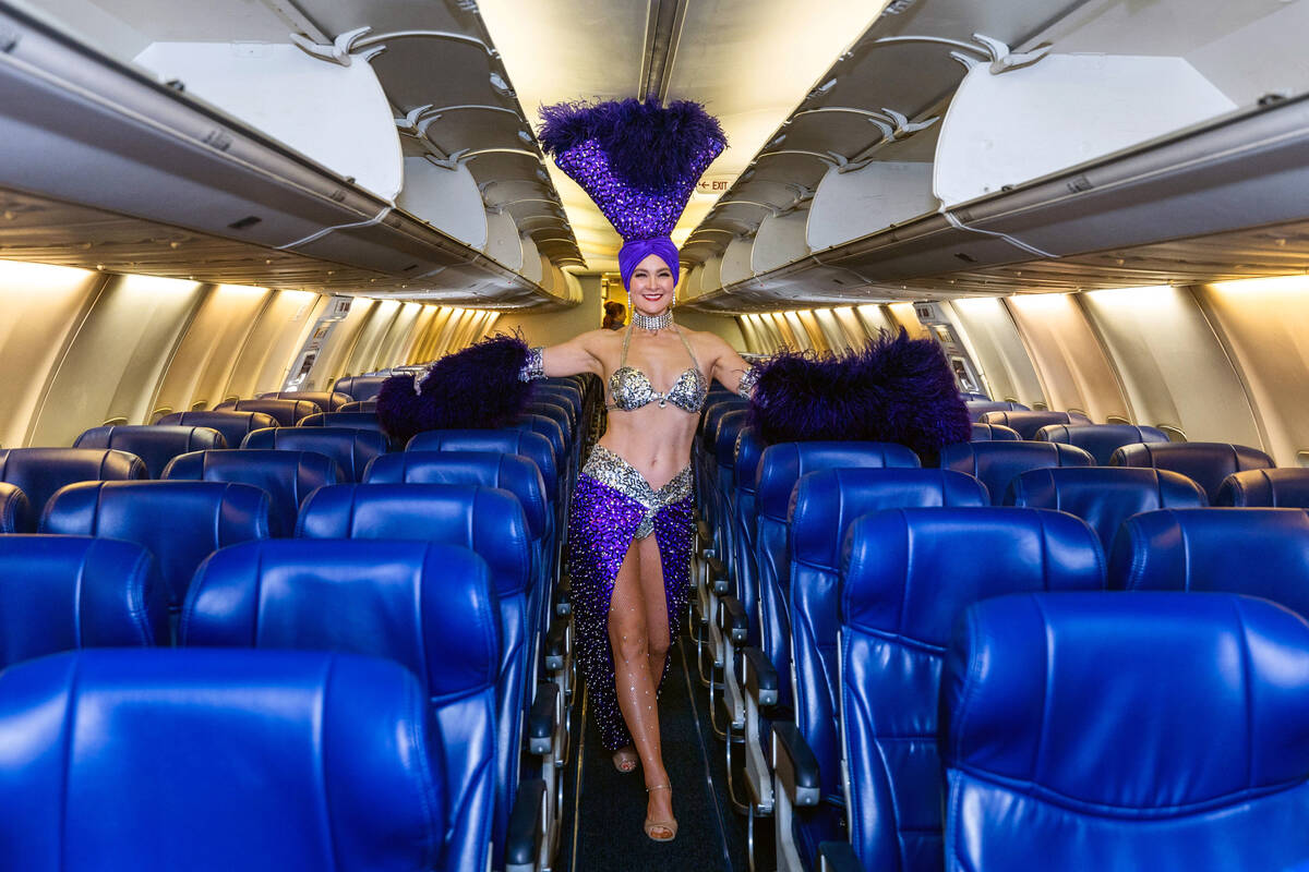 Showgirl Tara Taylor stands inside the airplane as Avelo Airlines begins four new nonstop desti ...