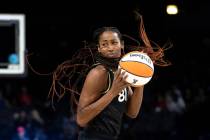 Las Vegas Aces center Alaina Coates (81) pivots to pass during the second half of a WNBA basket ...
