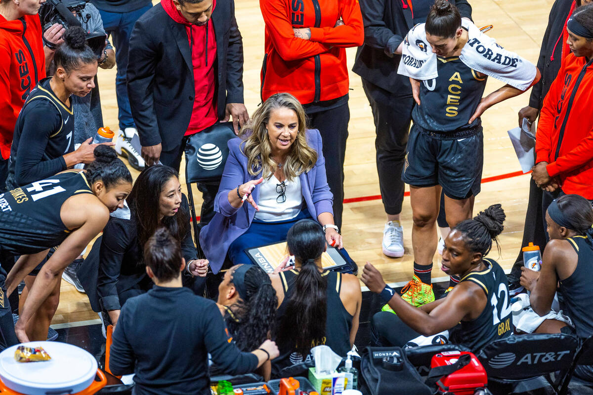 Las Vegas Aces head coach Becky Hammon counsels players during a timeout against the Connectic ...