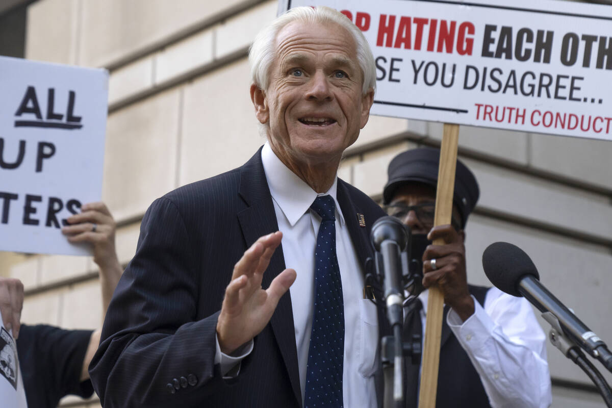 Former White House trade adviser Peter Navarro speaks to the media as he departs federal court, ...
