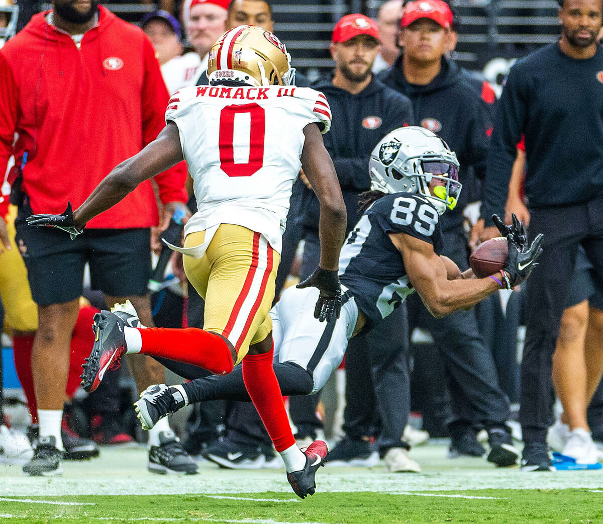 Raiders wide receiver Tre Tucker (89) catches a load p[ass over San Francisco 49ers cornerback ...