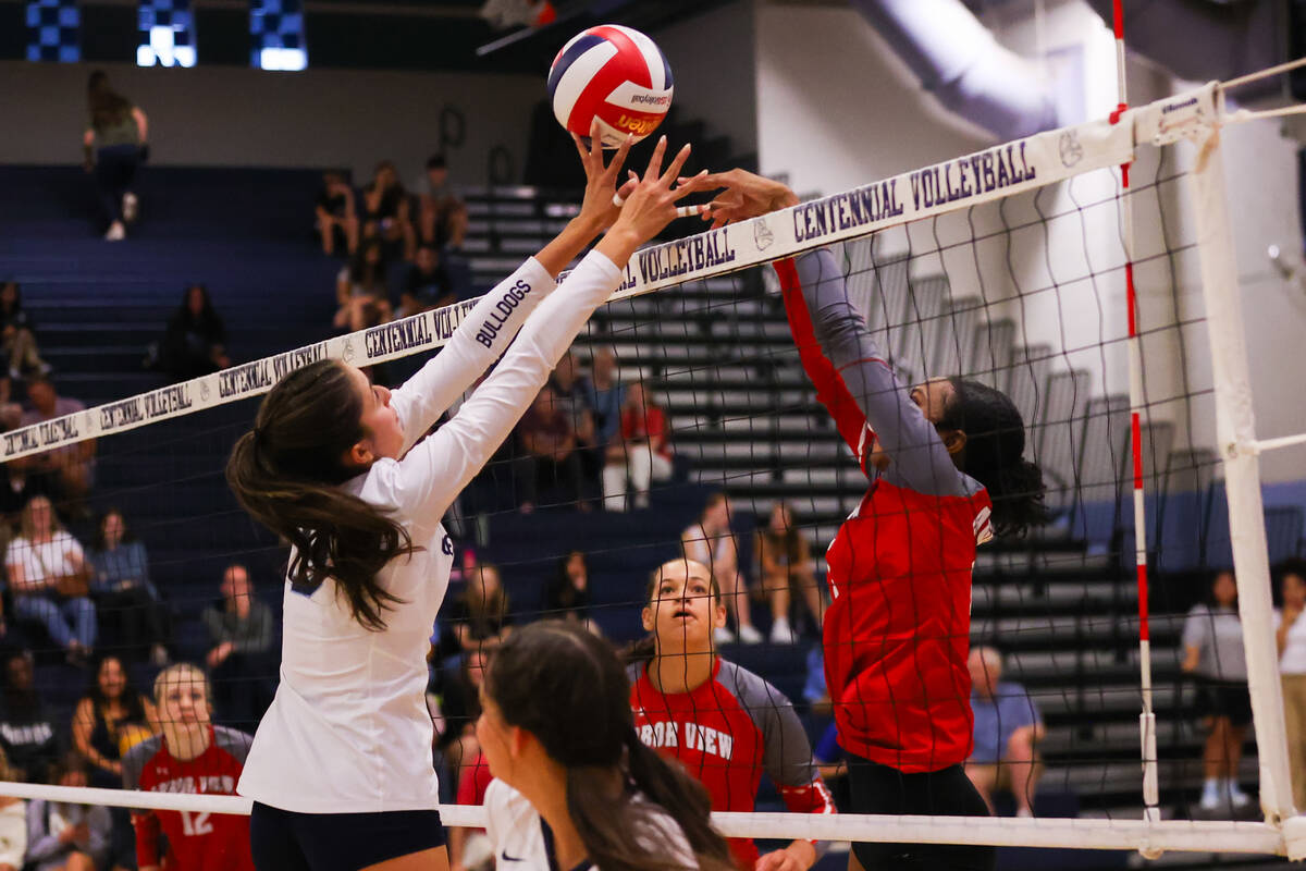 Centennial and Arbor View goes head to head at the net during a volleyball game between Centenn ...