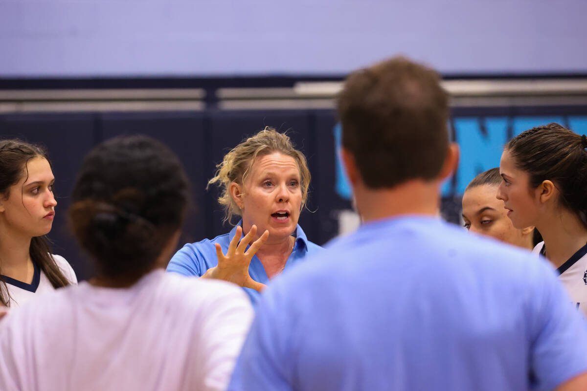 Centennial’s head coach Kristie Heaton talks to her players during a volleyball game bet ...