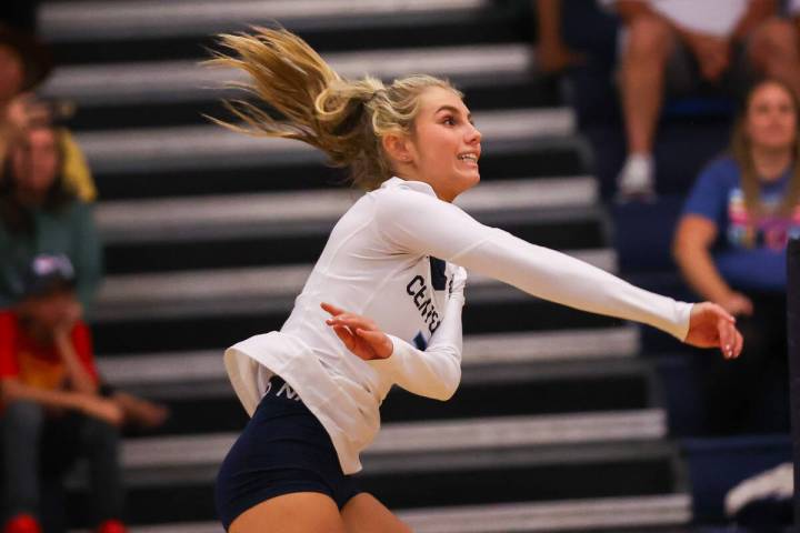 Centennial’s Olivia Roberts (3) spikes the ball during a volleyball game between Centenn ...