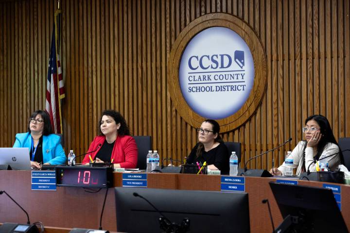 Clark County School District Board trustees Irene Bustamante Adams, left, Evelyn Garcia Morales ...