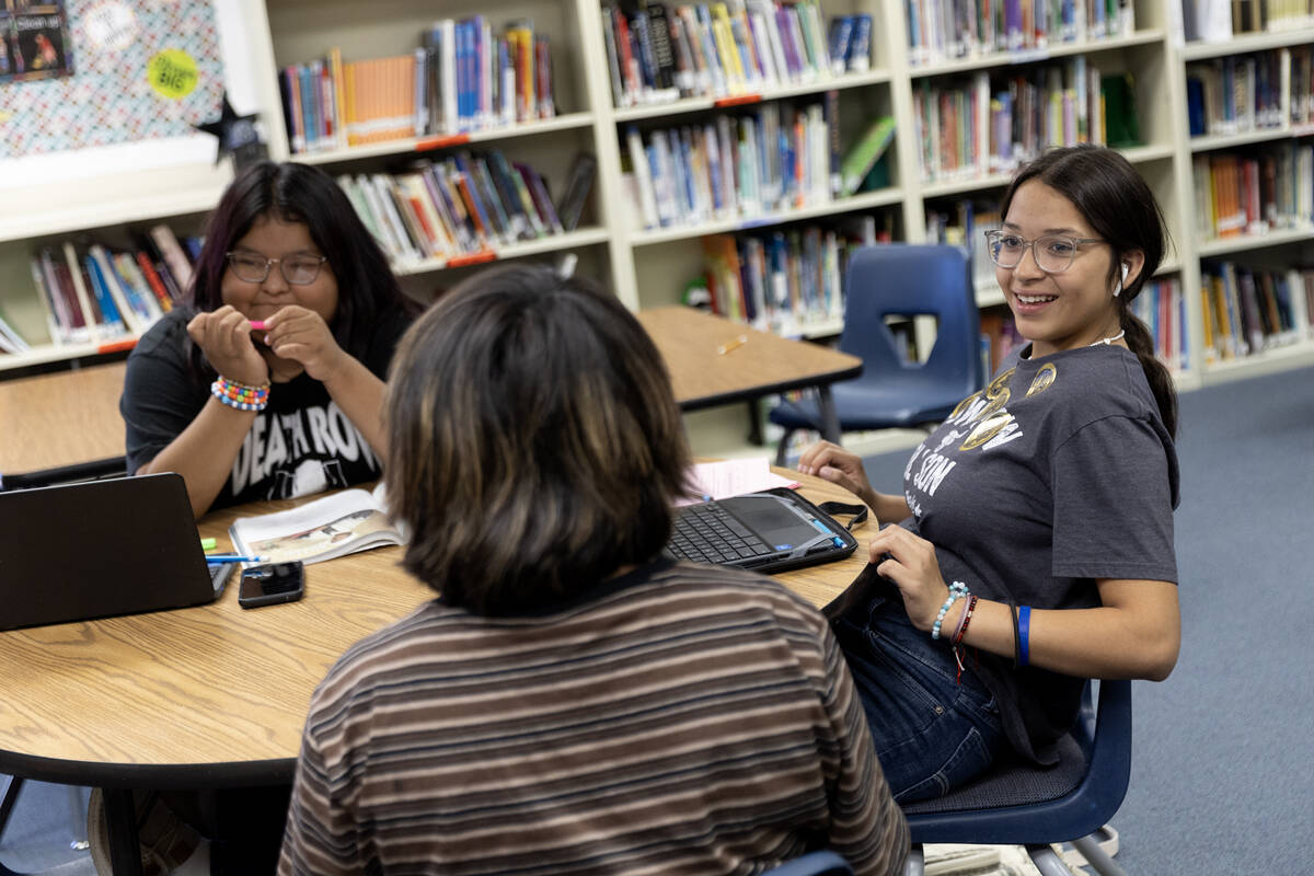 Aiyana Jim, left, and Shloe Anderson, right, do their homework after school at the Moapa Educat ...