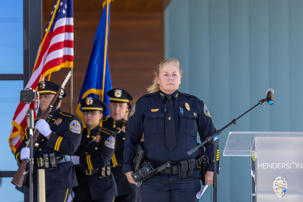 Henderson Police Chief Hollie Chadwick stands at attention as the colors are presented during t ...