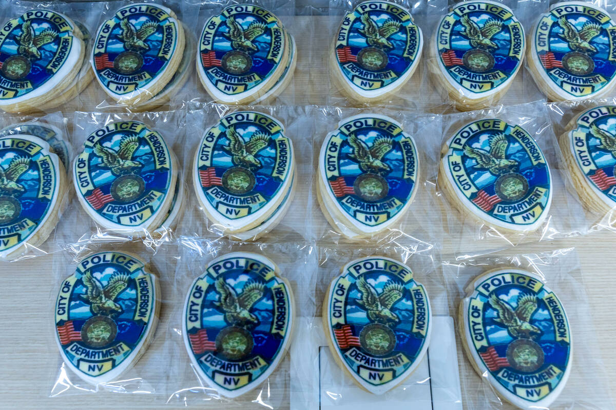 Members of the public enter are given custom cookies at the new Henderson West Police Substatio ...