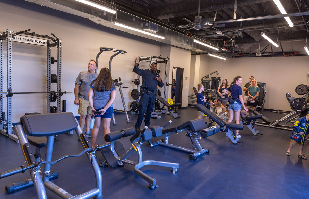 Members of the public enter are given a tour of the fitness center at the new Henderson West Po ...