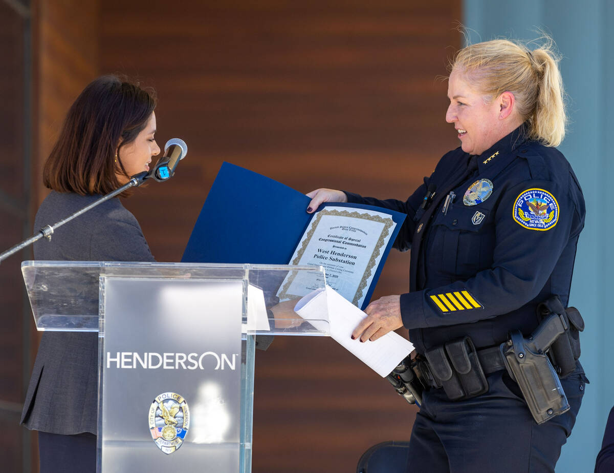 Demi Falcon presents Henderson Police Chief Hollie Chadwick with a certificate of special congr ...