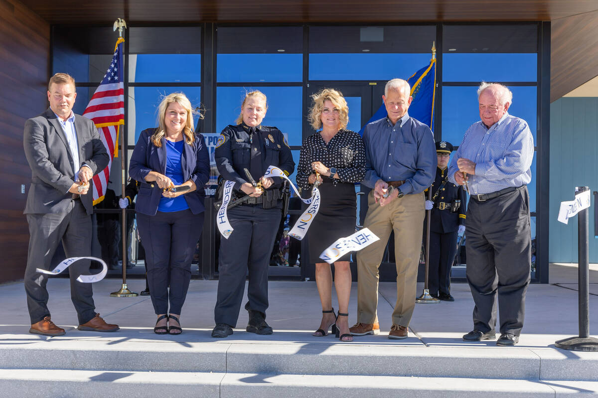 Henderson Police Chief Hollie Chadwick, center left, and invited officials cut a ribbon during ...