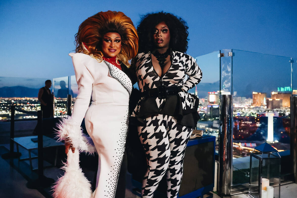 Taeya Mimosa, left, and Venus Soleil pose for photographs at the Ghostbar during the annual AFA ...