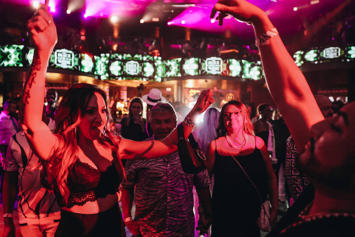 Misty Summer, left, dances with her friend, Carlos Quintero, during the annual AFAN Black and W ...