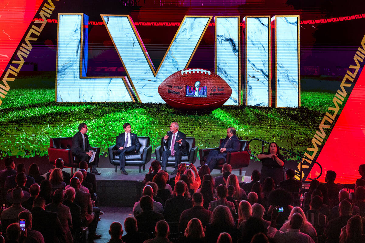 Host committee members are interviewed on stage as the National Football League and the Las Veg ...