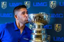 UMC Hospital Ambulatory Care worker Iqbal Hanifzai kisses the Stanley Cup during a visit for em ...