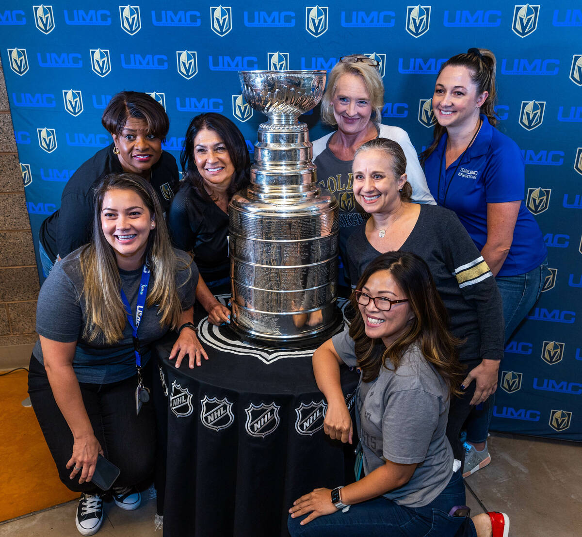 UMC Hospital Quality Department workers pose with the Stanley Cup during a visit for employees ...