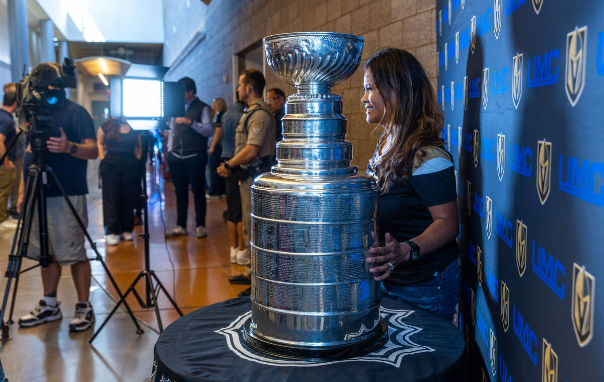 A UMC Hospital worker poses with the Stanley Cup during a visit for employees presented by the ...