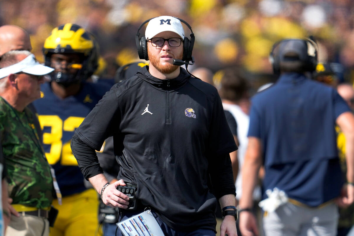 Michigan special teams coordinator Jay Harbaugh watches against UNLV in the first half of an NC ...