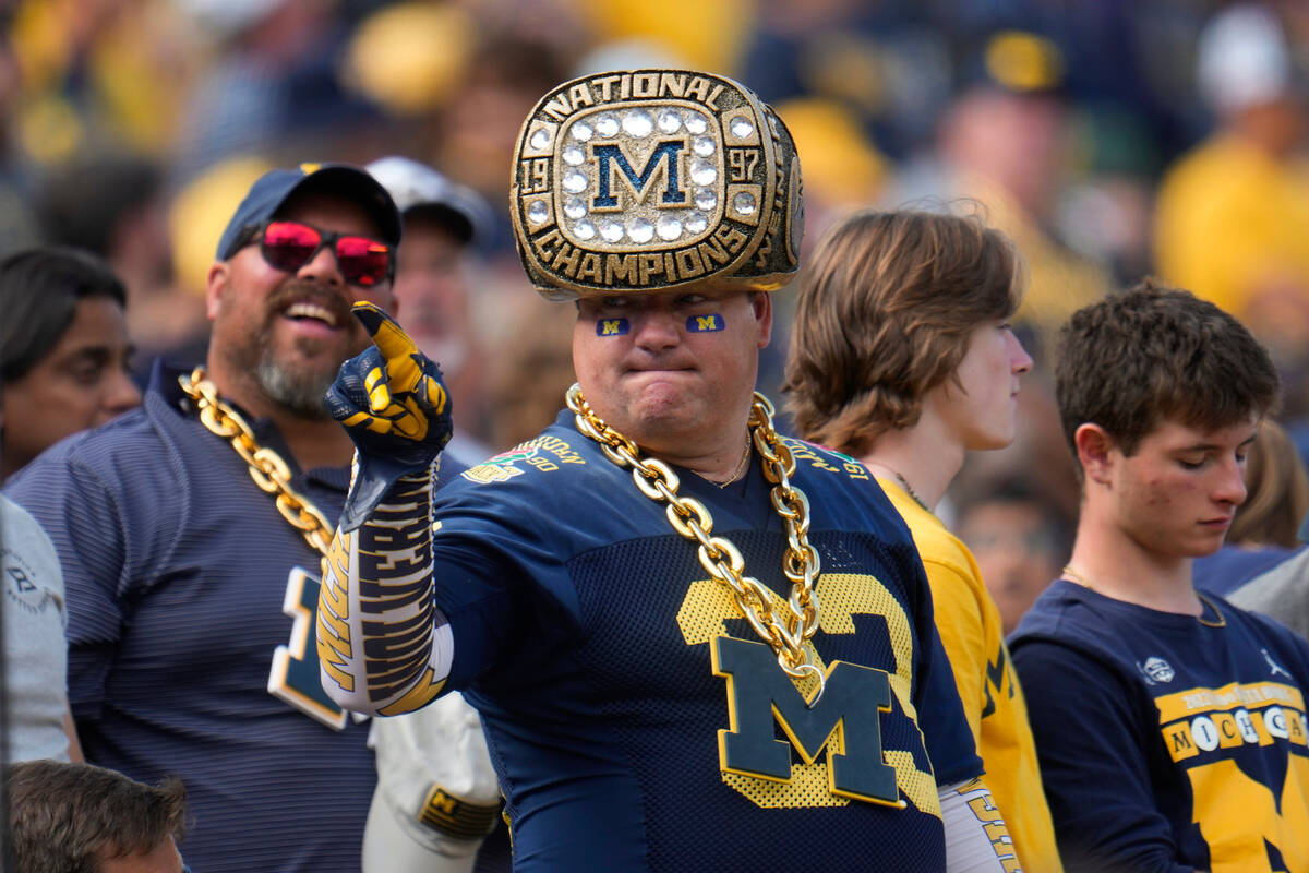 A Michigan fan watches against UNLV in the first half of an NCAA college football game in Ann A ...