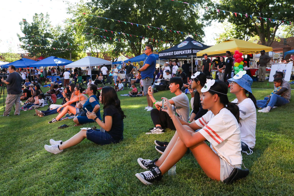 A large crowd watches the Lohan School of Shaolin perform at the Communities United, Raising Th ...