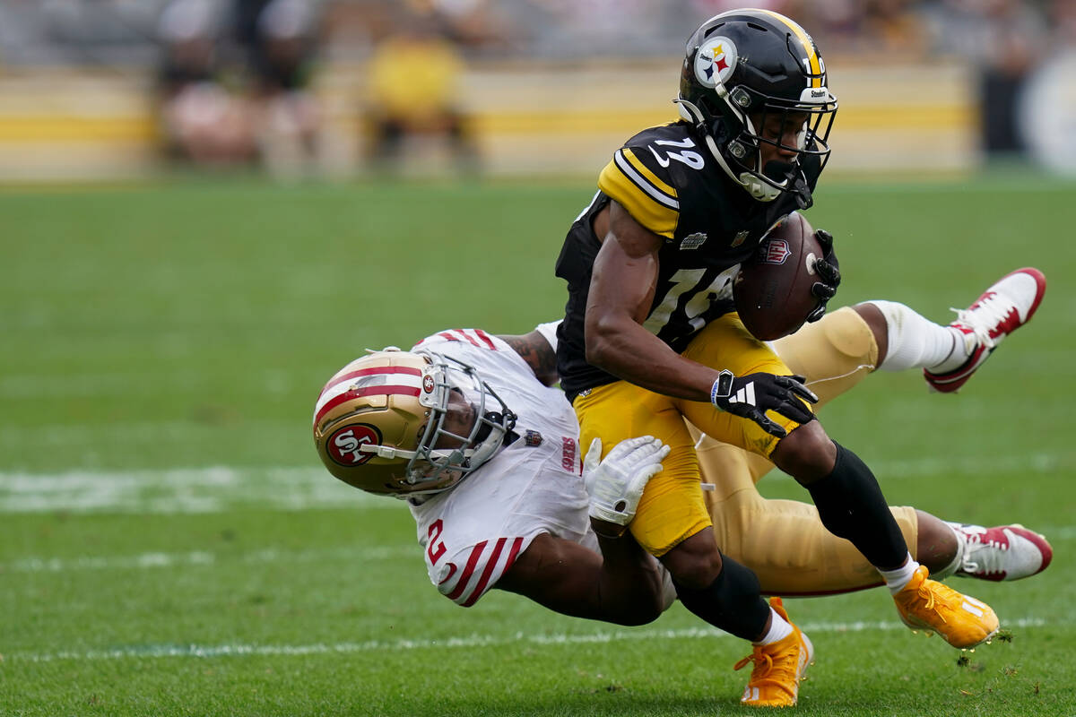Pittsburgh Steelers wide receiver Calvin Austin III (19) is tackled by San Francisco 49ers corn ...