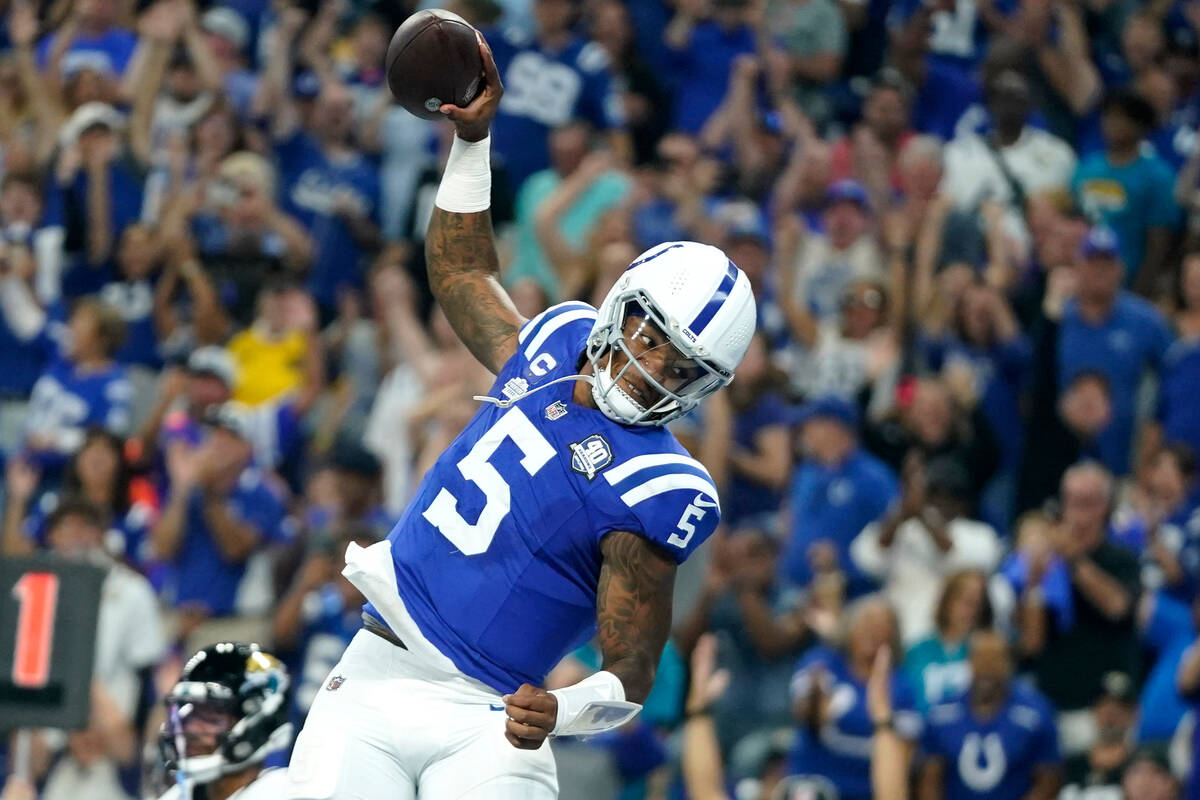 Indianapolis Colts quarterback Anthony Richardson celebrates after scoring during the first hal ...