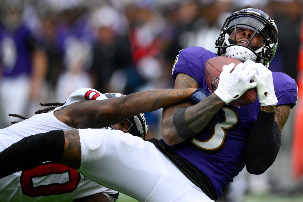 Baltimore Ravens' Odell Beckham Jr. catches a pass in front of Houston Texans' Shaquill Griffin ...