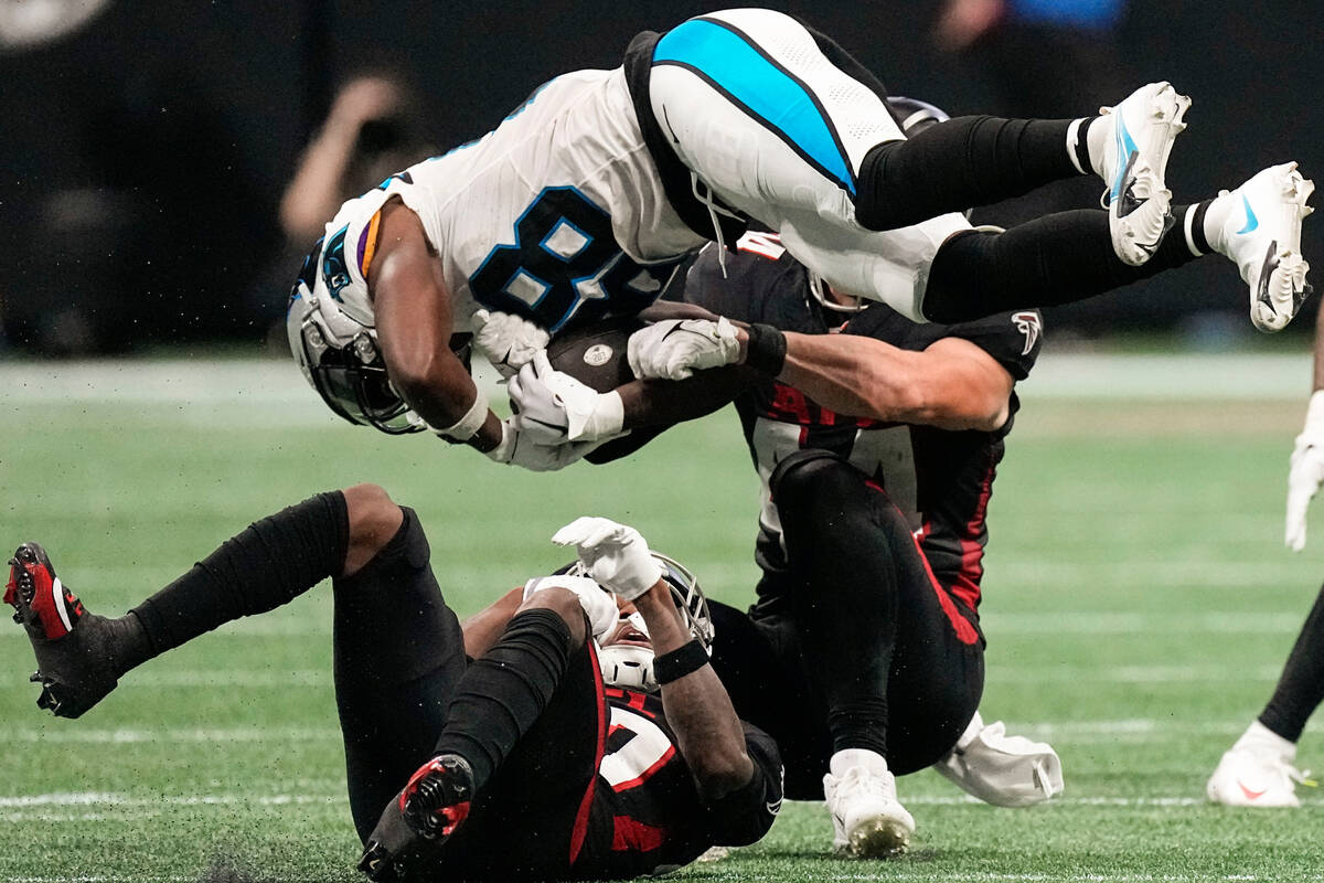Carolina Panthers wide receiver Terrace Marshall Jr. (88) is stopped by Atlanta Falcons linebac ...