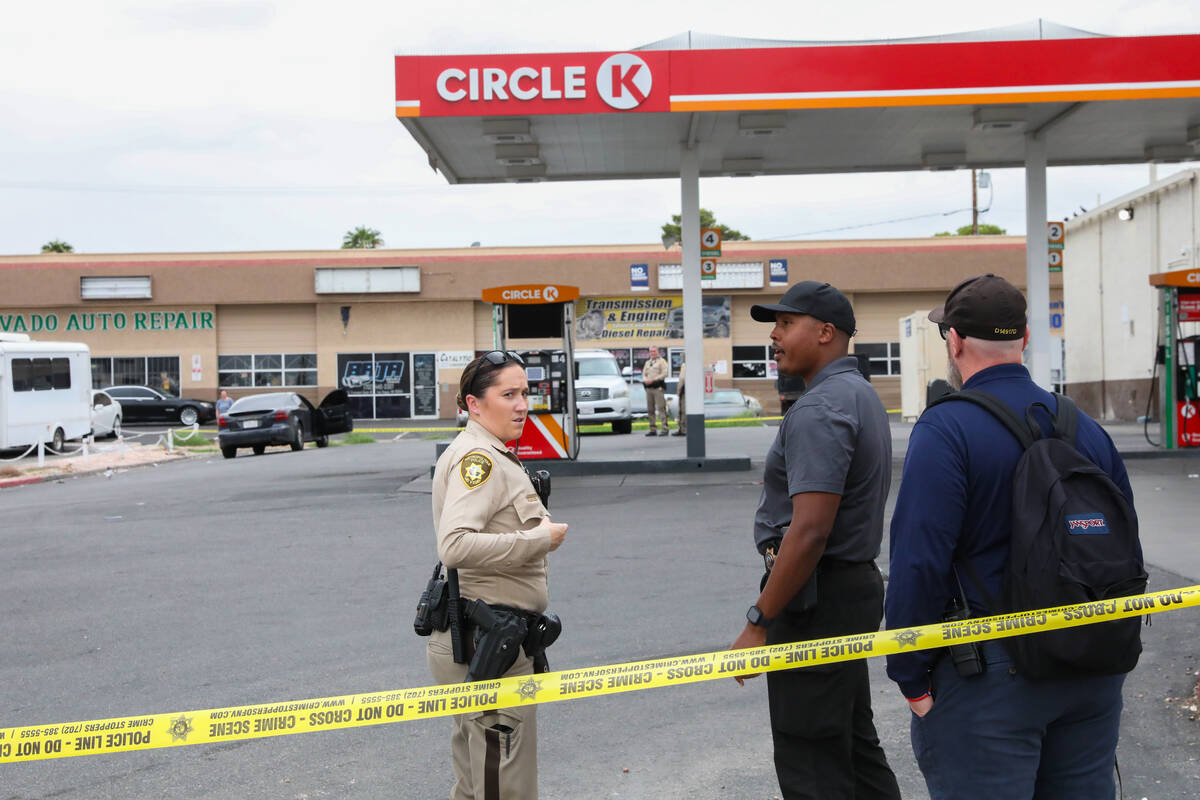 Police respond to a shooting at a Circle K on the corner of Fremont Street and St. Louis Avenue ...