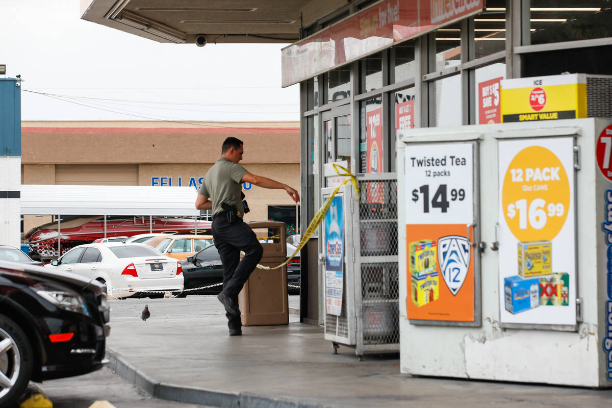 Police respond to a shooting at a Circle K on the corner of Fremont Street and St. Louis Street ...