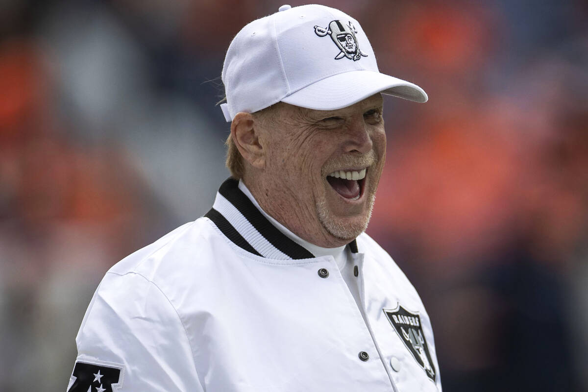 Raiders owner Mark Davis laughs from the sideline before the start of an NFL game against the D ...