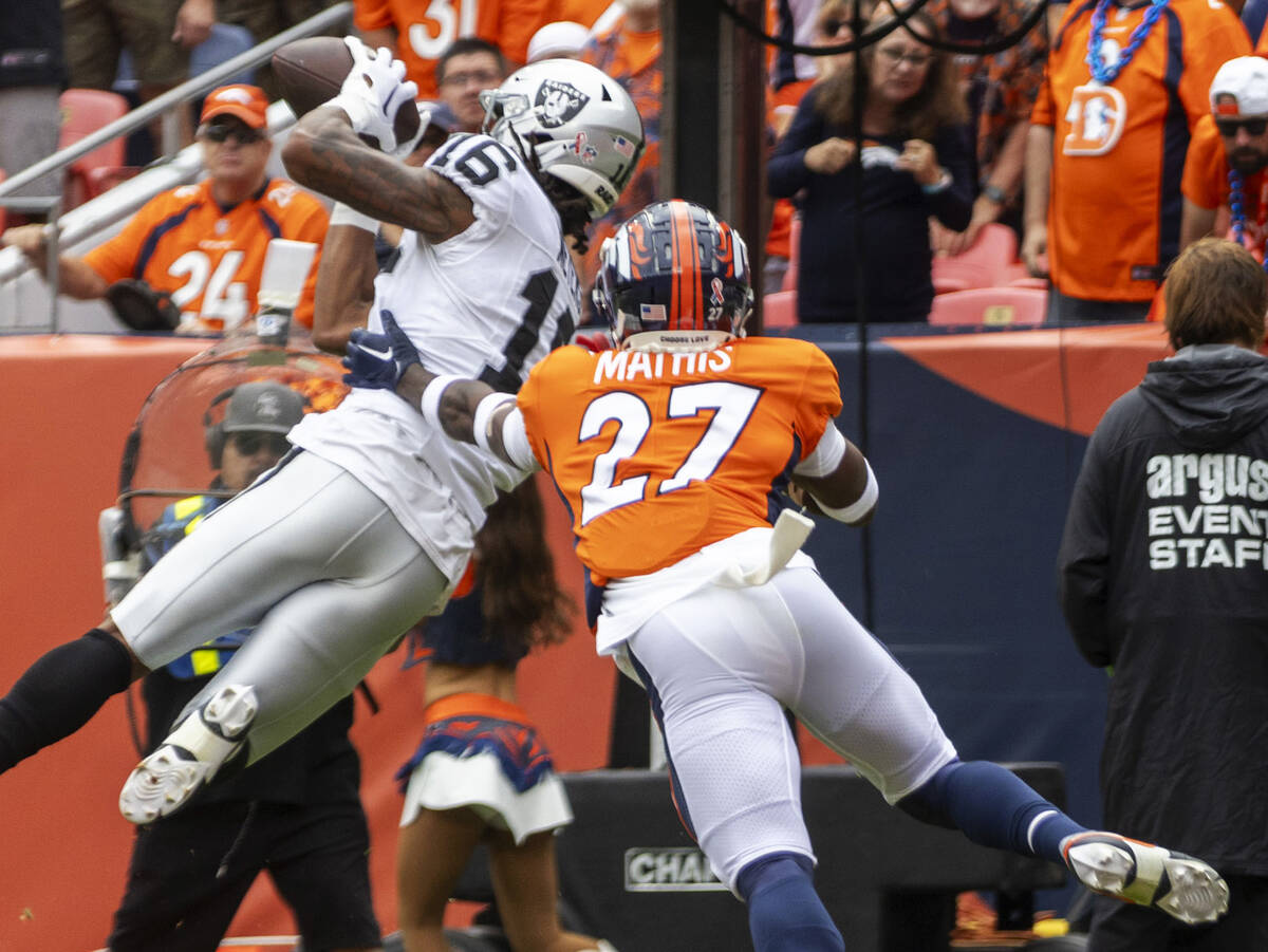 Raiders wide receiver Jakobi Meyers (16) scores a touchdown over Denver Broncos cornerback Dama ...