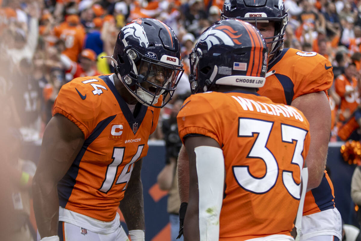 Denver Broncos wide receiver Courtland Sutton (14) celebrates his touchdown score with Denver B ...