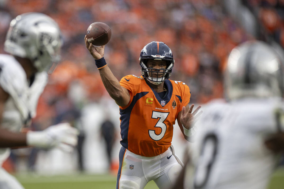 Denver Broncos quarterback Russell Wilson (3) makes a throw during the second half of an NFL ga ...