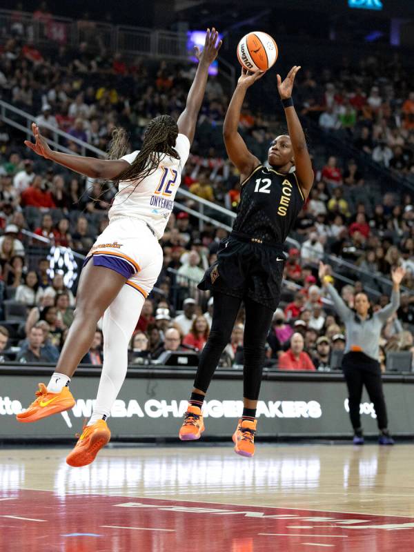 Las Vegas Aces guard Chelsea Gray (12) shoots against Phoenix Mercury forward Michaela Onyenwer ...