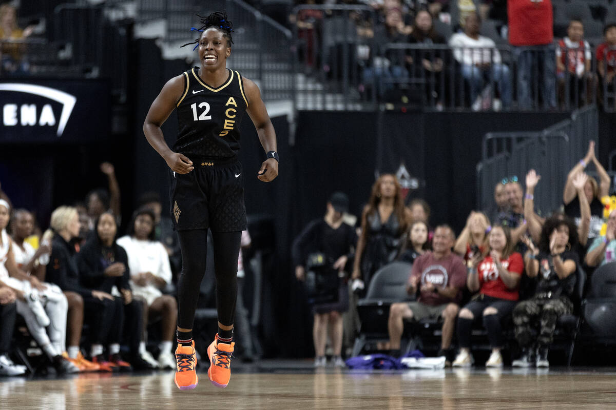 Las Vegas Aces guard Chelsea Gray (12) celebrates after scoring during the first half of a WNBA ...