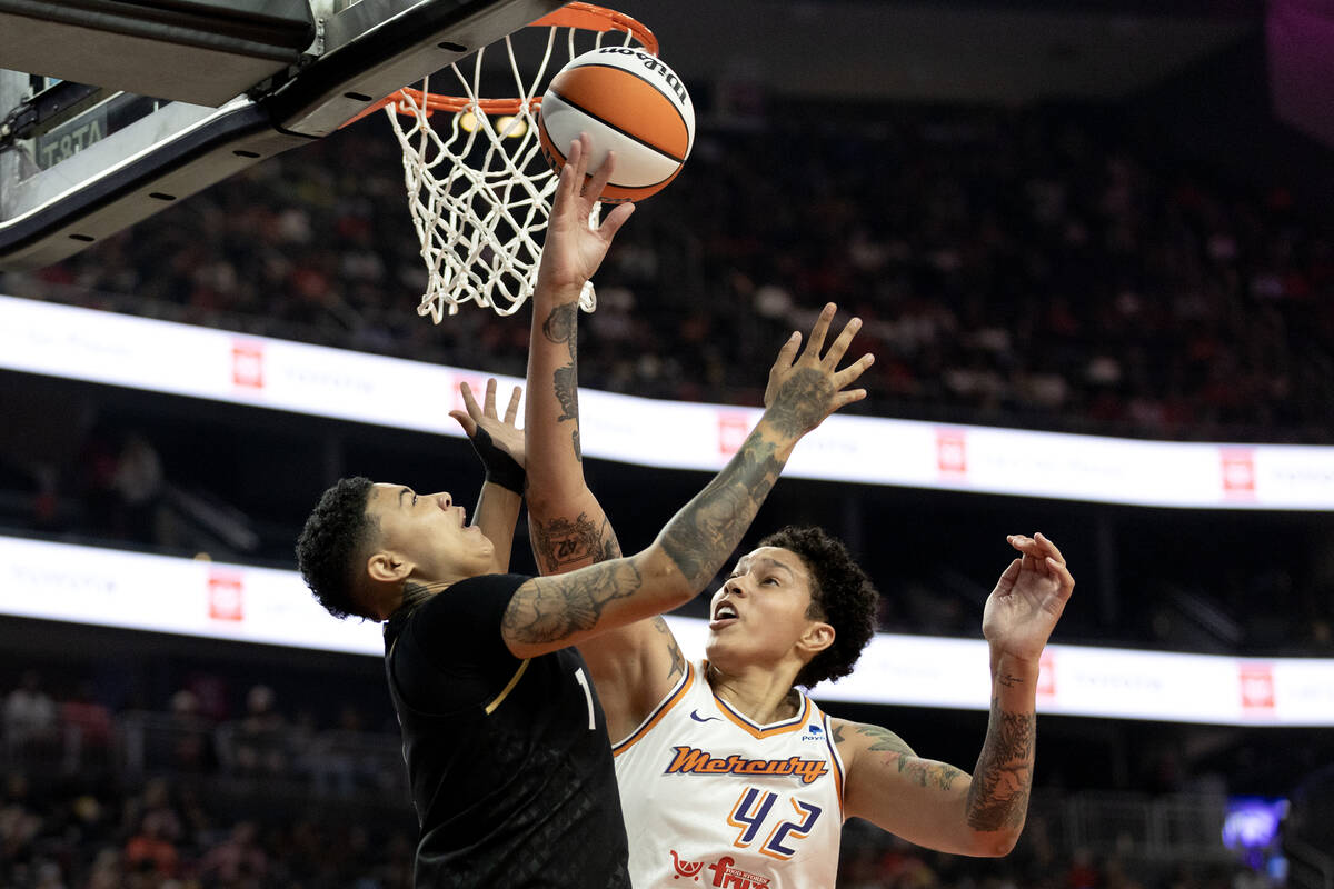Las Vegas Aces guard Kierstan Bell (1) shoots against Phoenix Mercury center Brittney Griner (4 ...