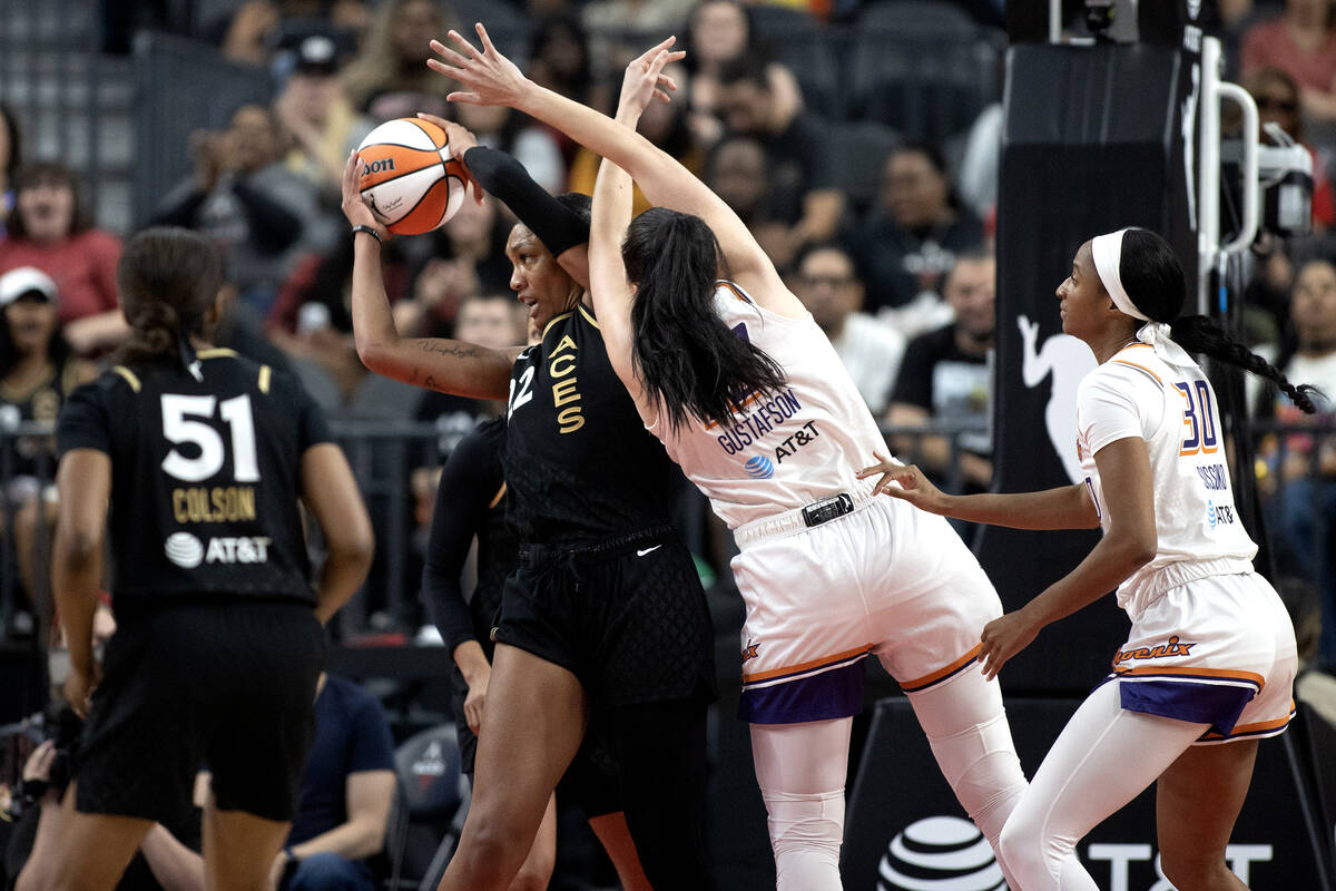 Las Vegas Aces forward A'ja Wilson (22) steals the ball from Phoenix Mercury center Megan Gusta ...