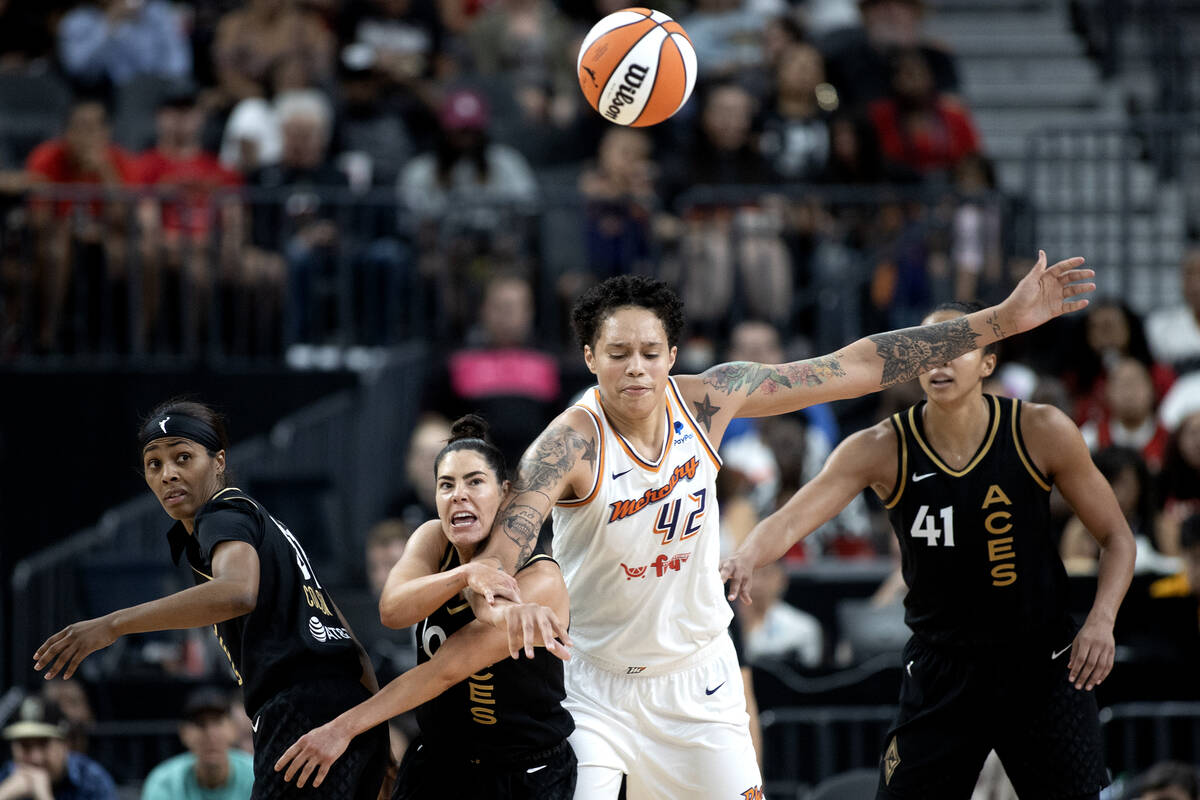 Las Vegas Aces guard Kelsey Plum (10) fouls Phoenix Mercury center Brittney Griner (42) during ...
