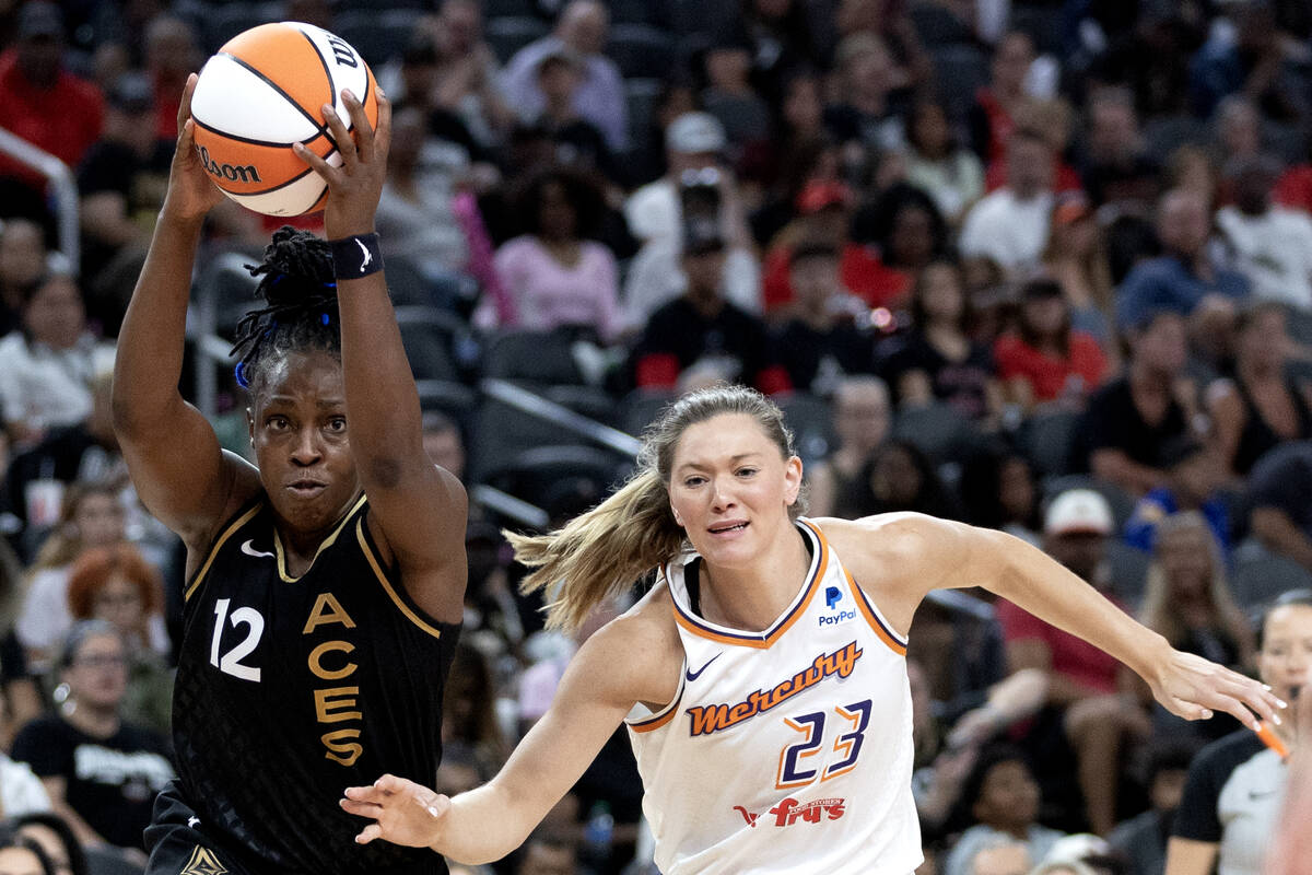 Las Vegas Aces guard Chelsea Gray (12) looks to pass while Phoenix Mercury guard Ashley Joens ( ...
