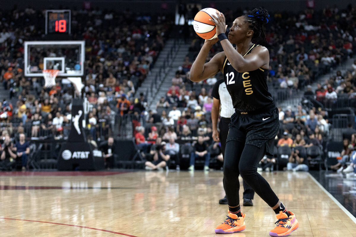 Las Vegas Aces guard Chelsea Gray (12) bends to shoot during the first half of a WNBA basketbal ...