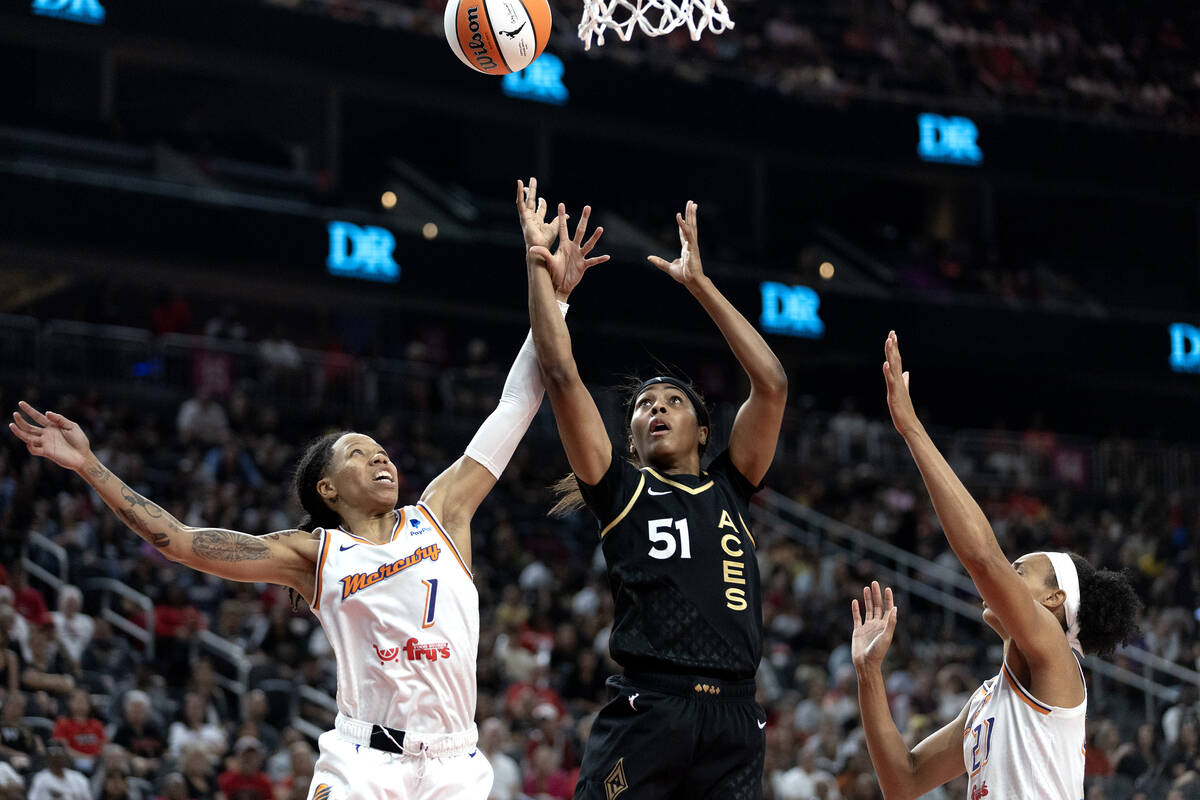 Las Vegas Aces guard Sydney Colson (51) jumps for a rebound against Phoenix Mercury guard Sug S ...