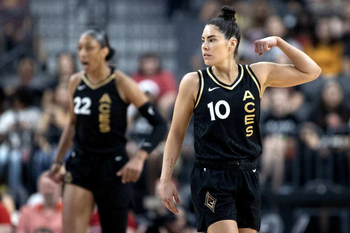 Las Vegas Aces guard Kelsey Plum (10) flexes during the first half of a WNBA basketball game ag ...