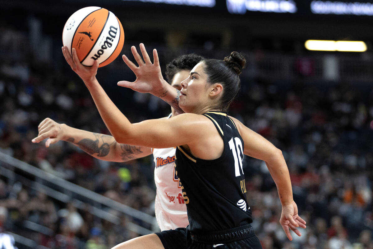 Las Vegas Aces guard Kelsey Plum (10) goes for a layup against Phoenix Mercury center Brittney ...